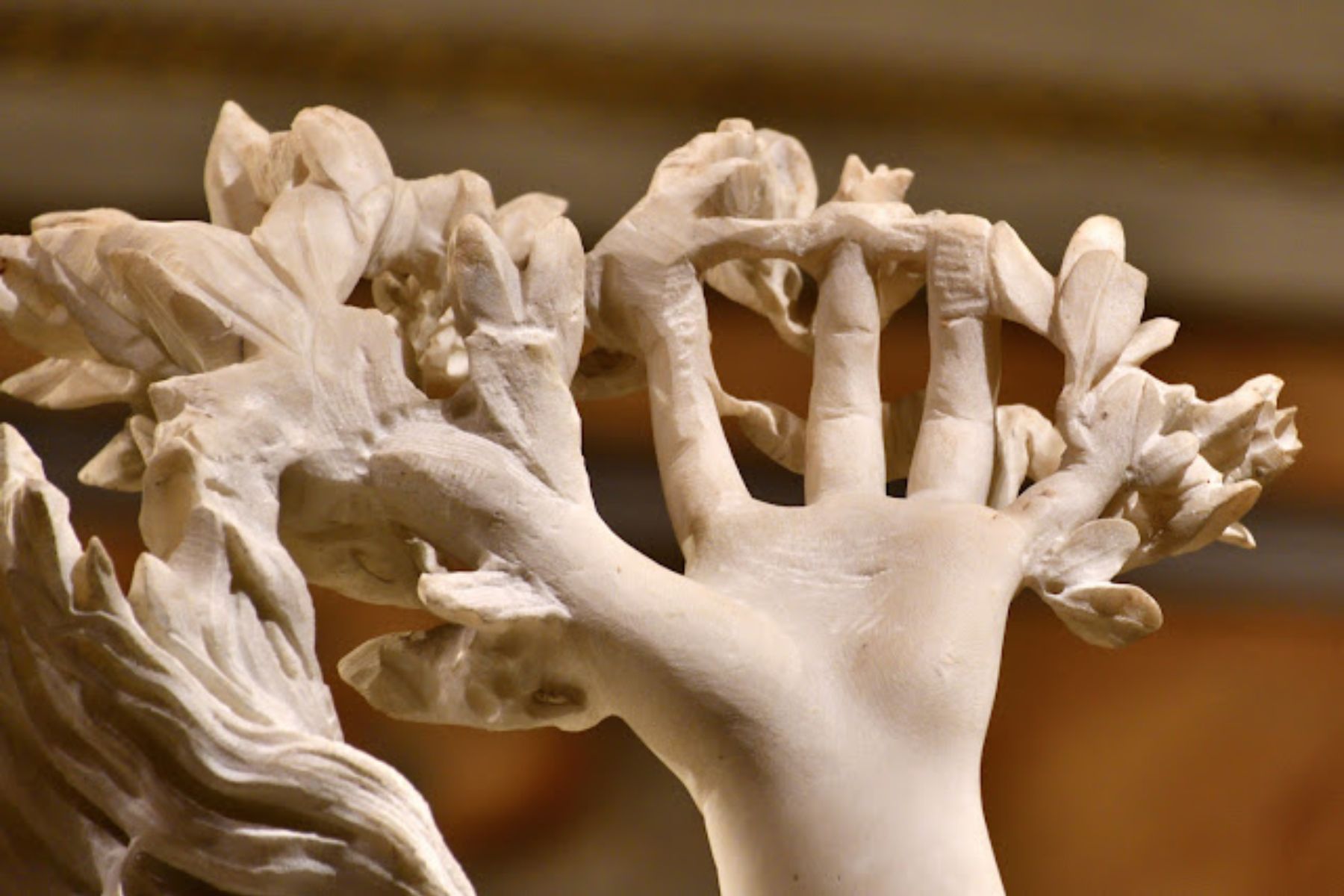 Apollo reaching for Daphne as she transforms into a tree, marble sculpture by Gian Lorenzo Bernini